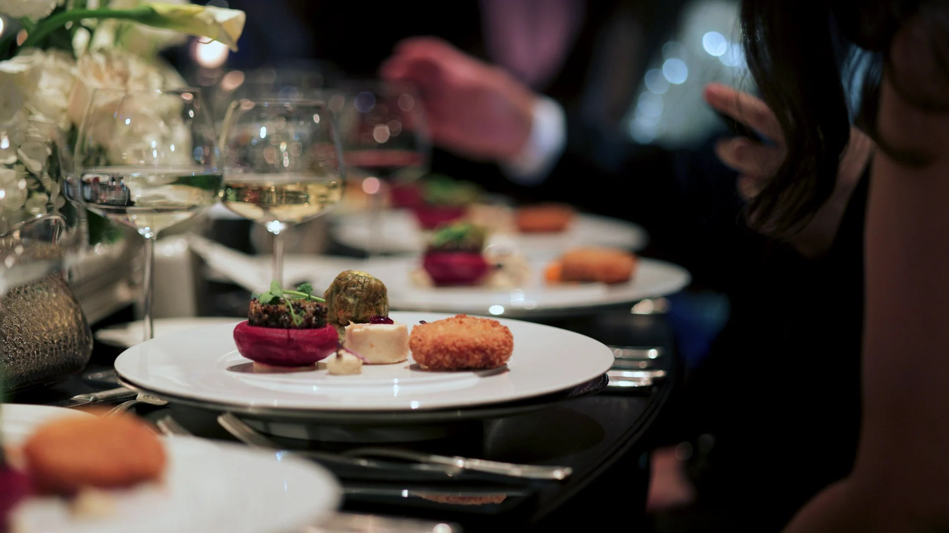 Beautifully plated gourmet dish with fine wine