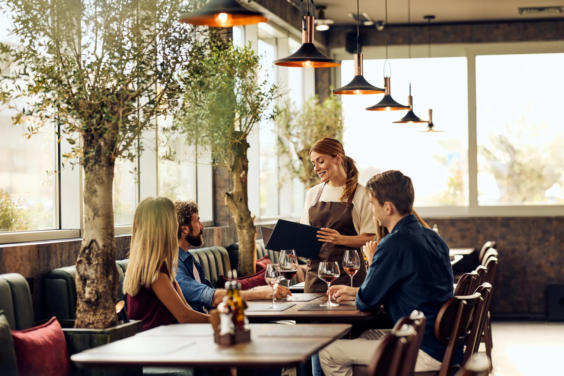 Professional waitress service in restaurant