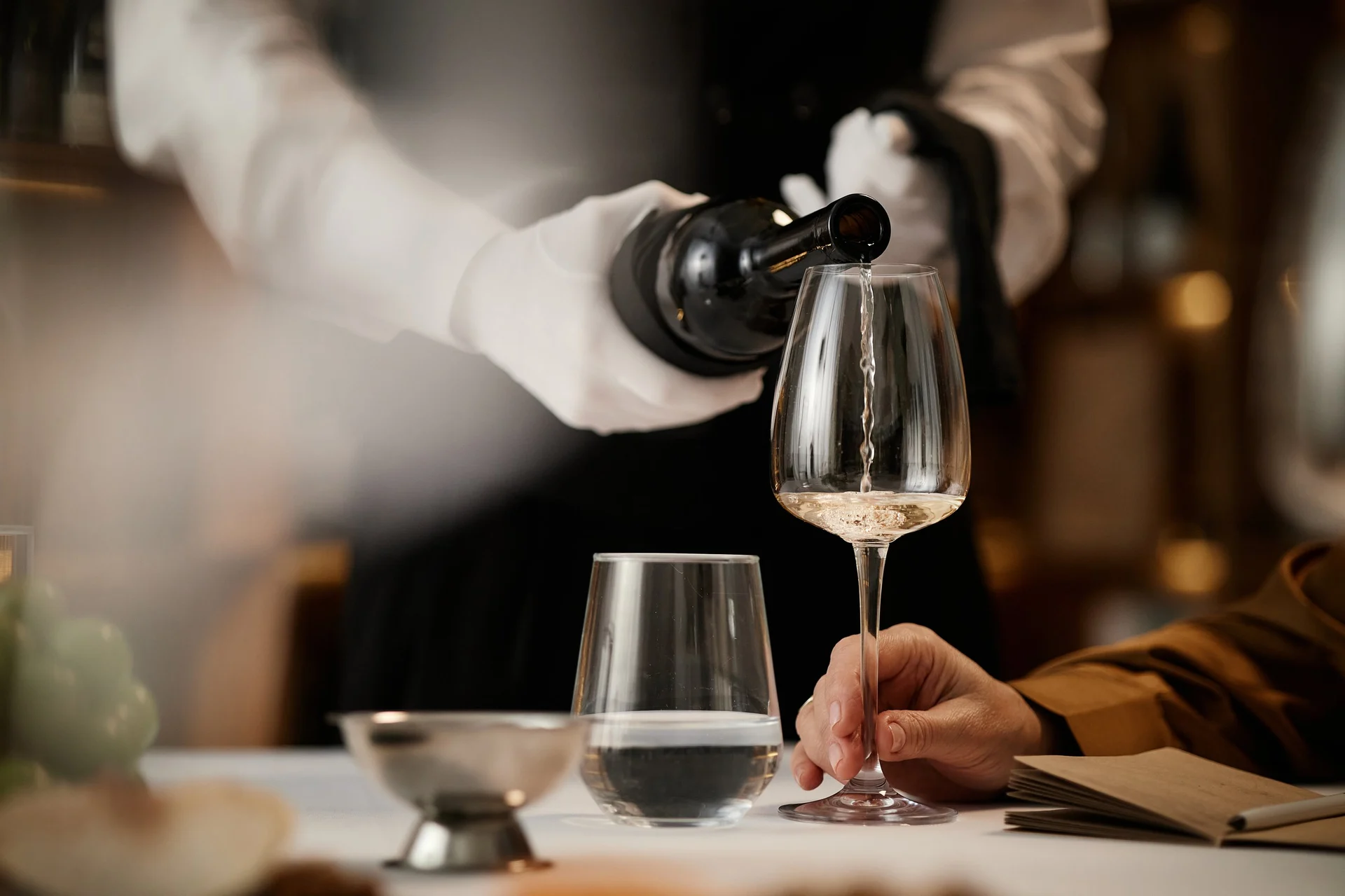 Sommelier pouring wine